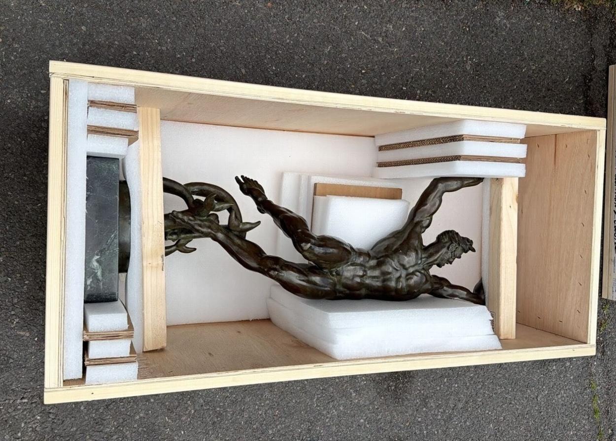 Bronze sculpture packed in wooden crate
